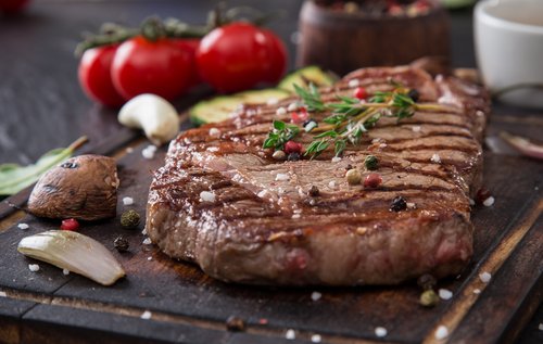 Beef,Rump,Steak,On,Black,Stone,Table,,Close-up.